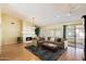 Spacious living room with fireplace, high ceilings, and natural light at 4546 E Villa Rita Dr, Phoenix, AZ 85032