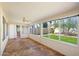 Sun room with tile flooring and expansive windows offering backyard views at 4546 E Villa Rita Dr, Phoenix, AZ 85032