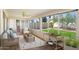 A sun room with couches, tile floor and view of a green back yard at 4546 E Villa Rita Dr, Phoenix, AZ 85032