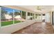A sun room with view of the green back yard, tile floor and white trim at 4546 E Villa Rita Dr, Phoenix, AZ 85032