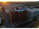 Stunning aerial view featuring rooftop pool and vibrant city skyline at sunset at 4808 N 24Th St # 303, Phoenix, AZ 85016