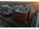 Breathtaking aerial showcasing modern building with rooftop garden and inviting rooftop pool at 4808 N 24Th St # 303, Phoenix, AZ 85016