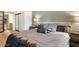 Comfortable bedroom featuring light colored hardwood floors, ensuite access, and neutral colors at 4808 N 24Th St # 303, Phoenix, AZ 85016