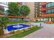 Beautiful courtyard with fountain, lawn, and seating areas at 4808 N 24Th St # 303, Phoenix, AZ 85016
