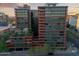 Striking exterior view of contemporary building with multi-level gardens and sleek design at 4808 N 24Th St # 303, Phoenix, AZ 85016