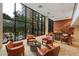 Inviting lobby with leather chairs, tables and a large window view at 4808 N 24Th St # 303, Phoenix, AZ 85016