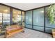 Enclosed patio featuring a swing, tile flooring and floor-to-ceiling windows overlooking the city at 4808 N 24Th St # 303, Phoenix, AZ 85016