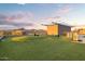 Expansive rooftop deck with artificial grass and sunset views at 4808 N 24Th St # 303, Phoenix, AZ 85016