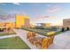 Rooftop deck with seating areas, artificial grass, and city views at 4808 N 24Th St # 303, Phoenix, AZ 85016