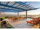 Spacious rooftop deck with dining and lounge seating and panoramic city views at 4808 N 24Th St # 303, Phoenix, AZ 85016