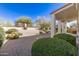 Private backyard featuring desert landscaping, mature shrubs, and a covered patio at 4815 E Fernwood Ct, Cave Creek, AZ 85331