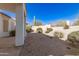 Relaxing backyard features a covered patio, desert landscaping and views of the surrounding desert at 4815 E Fernwood Ct, Cave Creek, AZ 85331