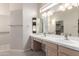 Bathroom features double sinks, large mirror and neutral cabinetry at 4815 E Fernwood Ct, Cave Creek, AZ 85331