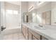Bright bathroom featuring double sinks and a shower-tub combination at 4815 E Fernwood Ct, Cave Creek, AZ 85331