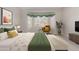 Tastefully staged bedroom features a bay window, neutral decor, and ample natural light at 4815 E Fernwood Ct, Cave Creek, AZ 85331