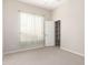 Neutrally decorated bedroom with window and walk-in closet at 4815 E Fernwood Ct, Cave Creek, AZ 85331
