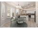 Cozy dining area adjacent to the kitchen, featuring a stylish table set and abundant natural light at 4815 E Fernwood Ct, Cave Creek, AZ 85331