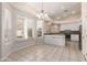 Bright breakfast nook adjacent to an open kitchen with white cabinets and stainless steel appliances at 4815 E Fernwood Ct, Cave Creek, AZ 85331