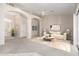 Bright, open living room featuring a neutral color palette, arched doorways, and sliding glass doors at 4815 E Fernwood Ct, Cave Creek, AZ 85331