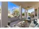 Relaxing covered patio with comfortable seating, offering a serene outdoor living space at 4815 E Fernwood Ct, Cave Creek, AZ 85331