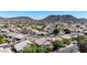 Serene neighborhood featuring well-maintained homes, lush greenery, and picturesque mountain views at 5811 W Irma Ln, Glendale, AZ 85308