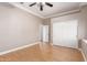 Bright bedroom with hardwood floors, ample natural light, and a spacious closet at 5811 W Irma Ln, Glendale, AZ 85308