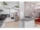 Elegant kitchen featuring stainless steel appliances, a center island, and ample cabinet space at 5811 W Irma Ln, Glendale, AZ 85308