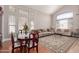 Well-lit living room showcasing tall ceilings, large windows, and neutral-toned furniture at 5811 W Irma Ln, Glendale, AZ 85308