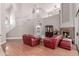 Bright living room featuring hardwood floors, a cozy fireplace, and an open staircase at 5811 W Irma Ln, Glendale, AZ 85308