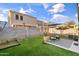 Artificial grass backyard featuring a patio area, ideal for outdoor living at 7010 W Downspell Dr, Peoria, AZ 85345