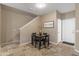 Cozy dining room with a dark wood table, travertine tile floors, and natural light at 7010 W Downspell Dr, Peoria, AZ 85345