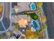 Aerial view of a home showcasing a pool, putting green, outdoor kitchen, and well-manicured grounds at 721 W Mountain Sky Ave, Phoenix, AZ 85045