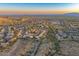 An aerial view of a desert community showcases the homes and natural landscape at 721 W Mountain Sky Ave, Phoenix, AZ 85045