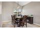 Cozy dining room with a wooden table, chairs, and a bright window at 721 W Mountain Sky Ave, Phoenix, AZ 85045