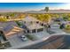 A two-story home with a tile roof and a three-car garage, surrounded by desert landscaping at 721 W Mountain Sky Ave, Phoenix, AZ 85045