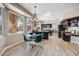 Open kitchen and breakfast nook featuring dark cabinets and natural light at 721 W Mountain Sky Ave, Phoenix, AZ 85045