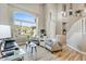 Bright living room featuring wood floors, large windows, and stylish furniture at 721 W Mountain Sky Ave, Phoenix, AZ 85045