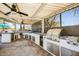Spacious outdoor kitchen with modern appliances, ample counter space, and bar seating at 721 W Mountain Sky Ave, Phoenix, AZ 85045