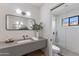 Bright bathroom featuring modern fixtures, glass shower door, and a stylish design at 7520 E Valley View Rd, Scottsdale, AZ 85250
