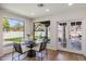 Bright breakfast nook features a modern table with large windows overlooking a beautiful outdoor patio at 7520 E Valley View Rd, Scottsdale, AZ 85250