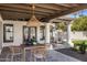 Covered patio features an outdoor dining area and lounge seating, great for relaxation and entertaining at 7520 E Valley View Rd, Scottsdale, AZ 85250