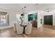 Bright dining room with modern lighting, green backsplash, and stylish decor at 7520 E Valley View Rd, Scottsdale, AZ 85250