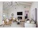 Stylish living room featuring high ceilings, a fireplace, and comfortable seating at 7520 E Valley View Rd, Scottsdale, AZ 85250