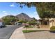 Street view of a home featuring desert landscaping with a mountain in the background at 7520 E Valley View Rd, Scottsdale, AZ 85250