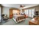 Comfortable bedroom featuring built-in storage, a cozy bed, and a functional workspace at 7807 E Granada Rd, Scottsdale, AZ 85257