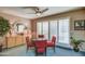 Bright dining area with shuttered windows, a round table, and stylish buffet, ideal for meals at 7807 E Granada Rd, Scottsdale, AZ 85257