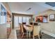 Elegant dining room with modern lighting, comfortable seating, and stylish pass-through to kitchen at 7807 E Granada Rd, Scottsdale, AZ 85257