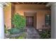 The front entryway is framed by pillars and well-manicured landscaping at 7807 E Granada Rd, Scottsdale, AZ 85257