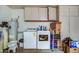 Utility area with appliances and white cabinets at 7807 E Granada Rd, Scottsdale, AZ 85257