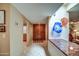 Bright, airy hallway with tile flooring leads to a double-door entrance at 7807 E Granada Rd, Scottsdale, AZ 85257